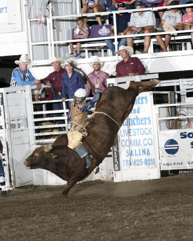 Bulls Creek Young on R23 Deal Me In; Creek Young, Rogersville, Mo., wins the bull riding at the 2022 Abilene rodeo with an 88 point ride. Photo by Fly Thomas.